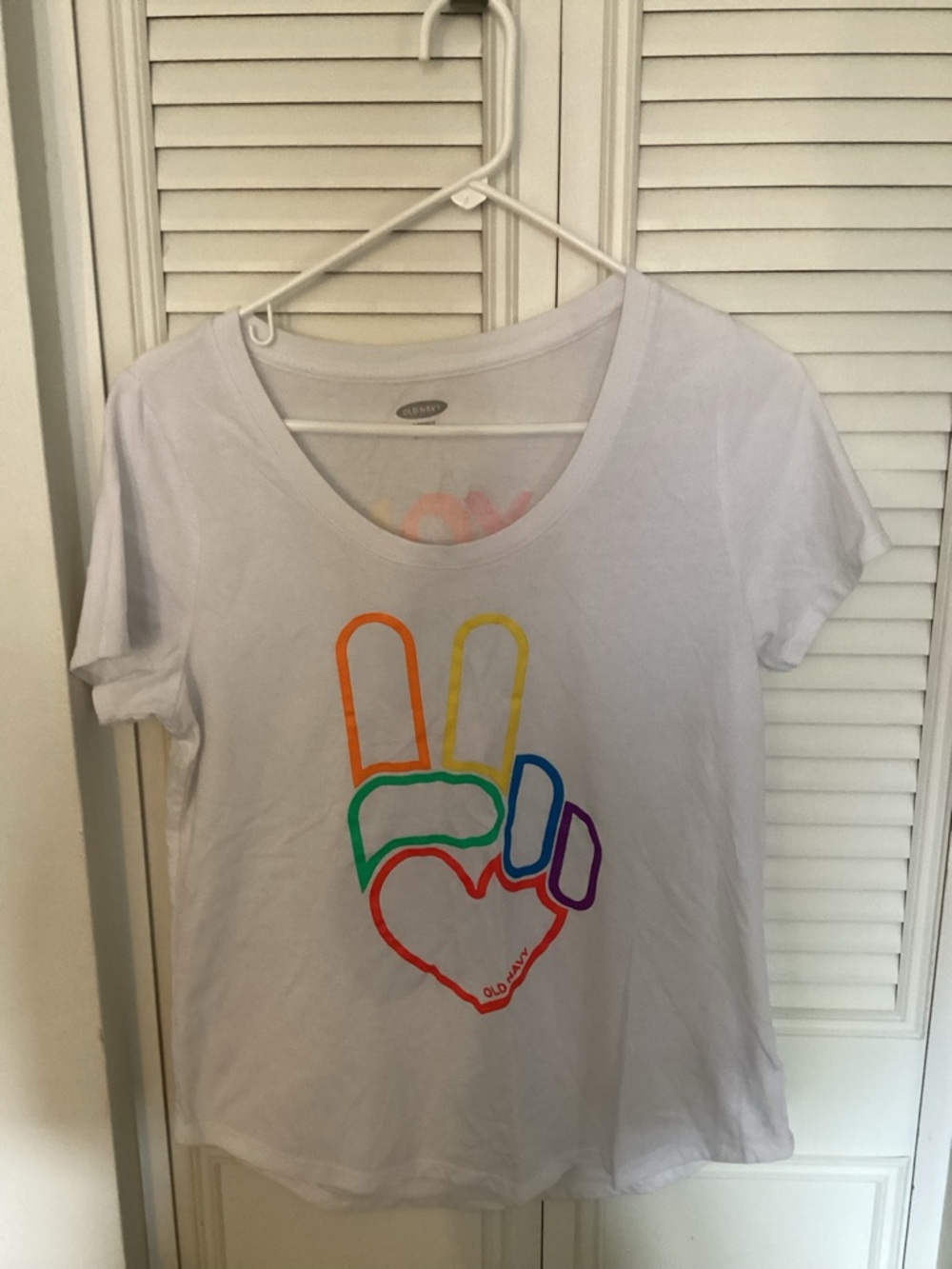 Two Old Navy Tee’s one white and one Black Tee with Pastel Multicolor Lettering.